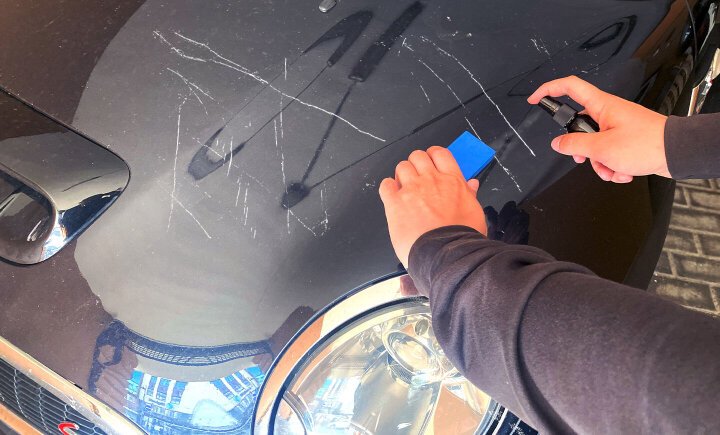 NuraFix nano spray applied to car paint — filling scratches and reviving the finish